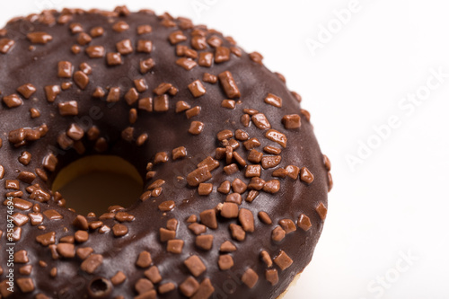 Chocolate donut on a white background close-up.