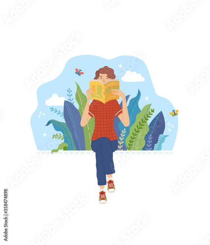 Young woman reading book outdoor