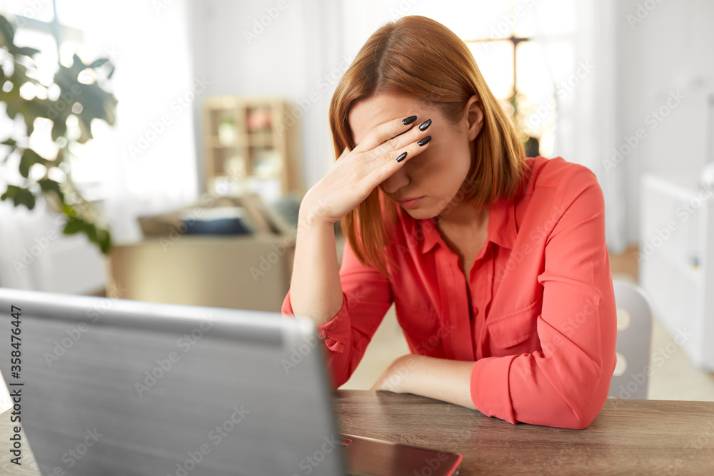 remote job, technology and people concept - tired or stressed young woman with laptop computer working at home office remote job, technology and people concept - tired or stressed young woman with laptop computer working at home office