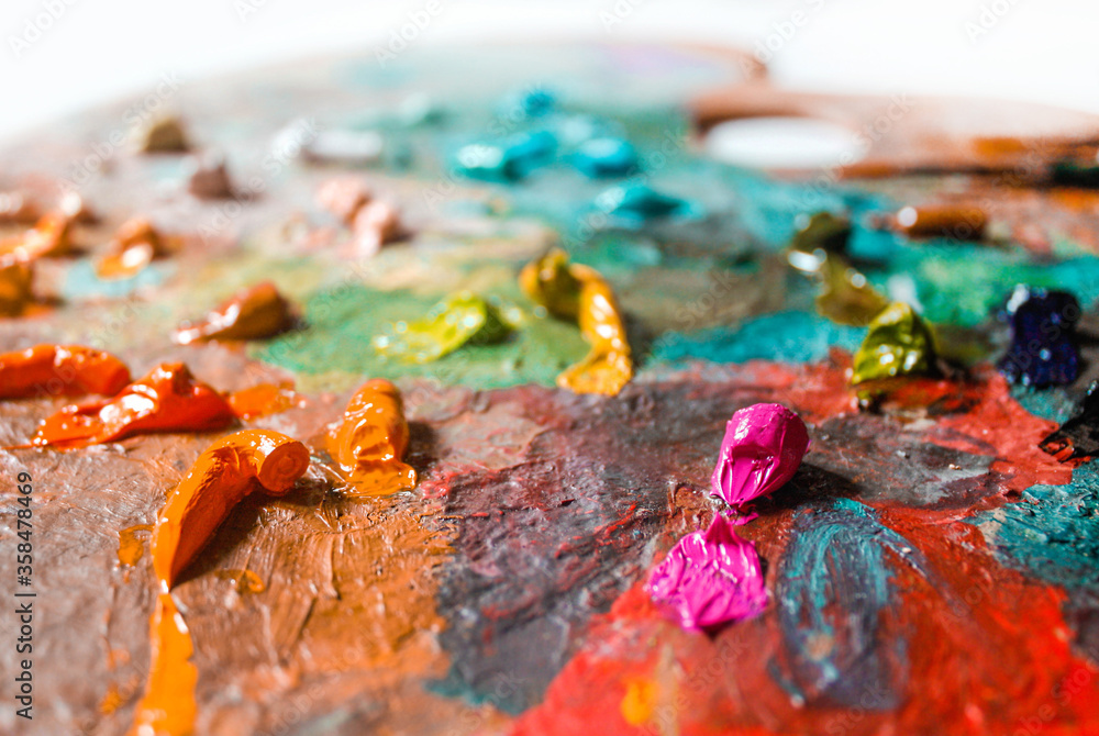 Colorful palette with oil paints textured, close up Colorful palette with oil paints textured, close up