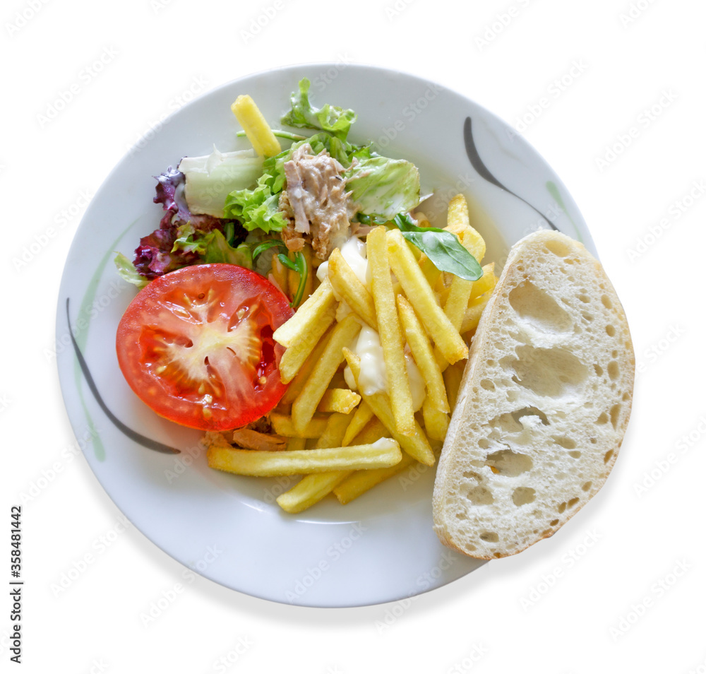 Plate of food. French fries, tomato, salad and bread. Isolated image on a white background. Top view. Plate of food. French fries, tomato, salad and bread. Isolated image on a white background. Top view.