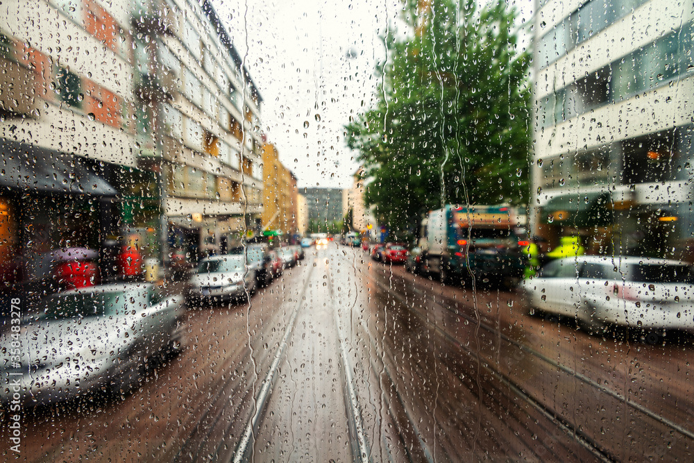 Rain drops on the window with streets of Helsinki, Finland Rain drops on the window with streets of Helsinki, Finland