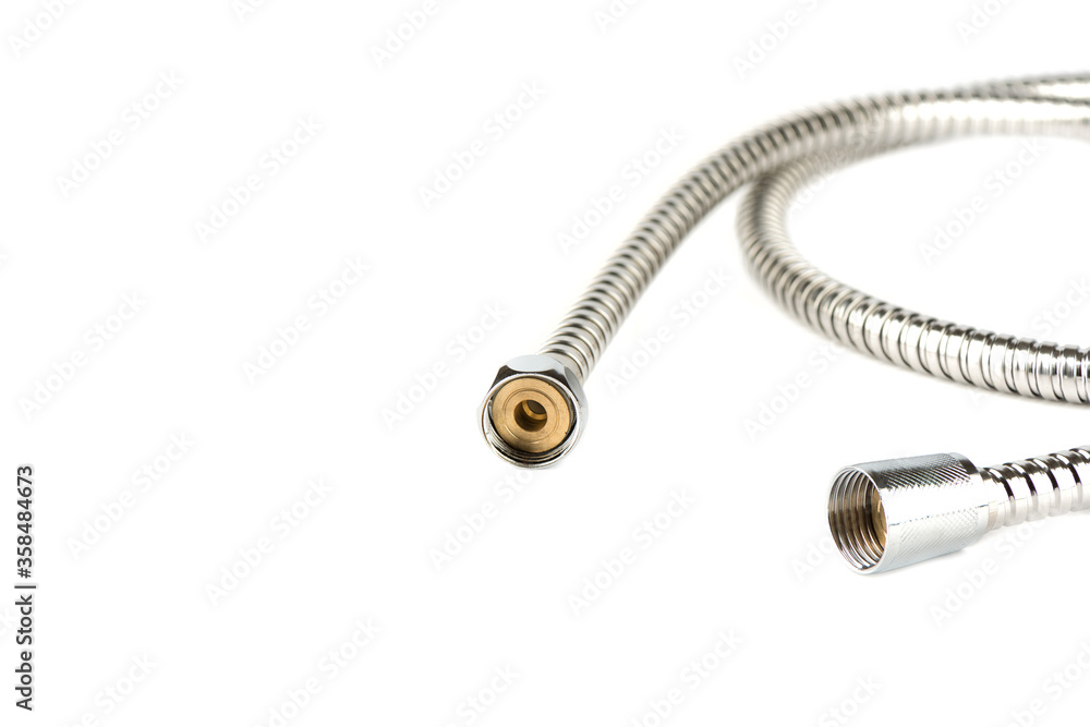 Connectors of a flexible hose for a shower in a bathroom on a white background. Connectors of a flexible hose for a shower in a bathroom on a white background.
