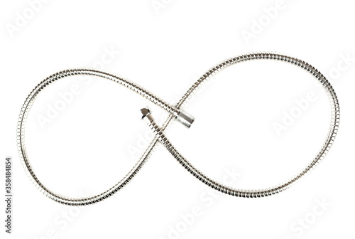 Curve made of corrugated stainless steel shower hose with connectors on a white background.