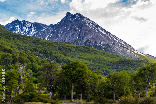 It s Landscape of the rock behind of the beautiful green forest.