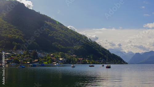 photo background yachts and mountain views in the distance on the alpine lake Traunsee in the vicinity of Gmunden, Austria, Europe