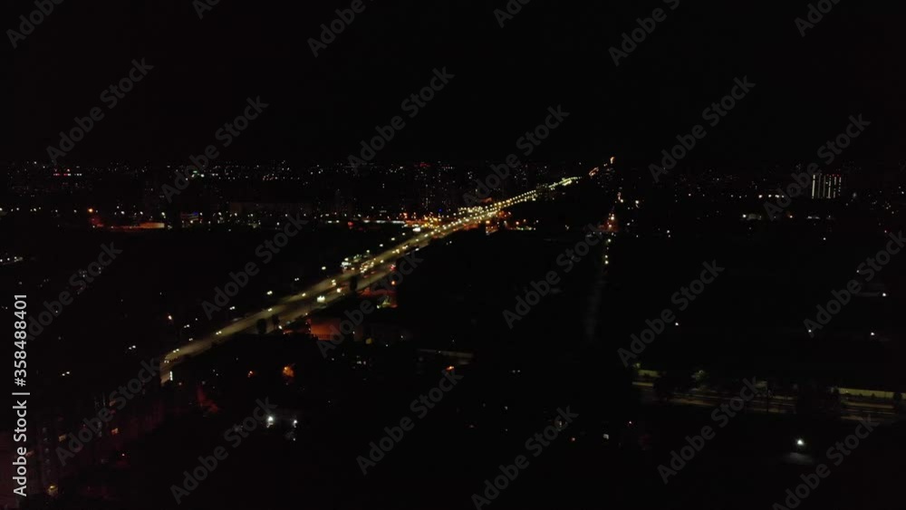 Night car traffic cityscape infrastructure dark aerial drone view Night car traffic cityscape infrastructure dark aerial drone view
