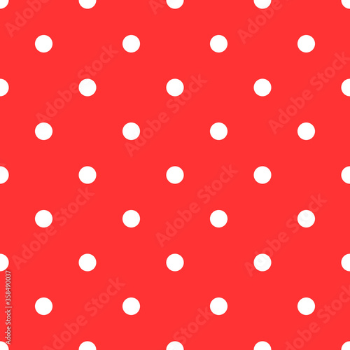 Simple red and white polka dot pattern. Seamless ornament with small round shapes.