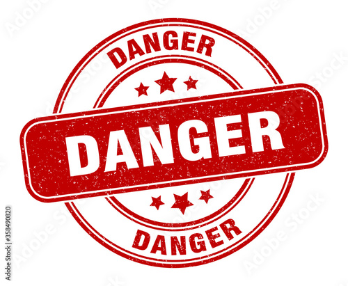 danger stamp. danger label. round grunge sign