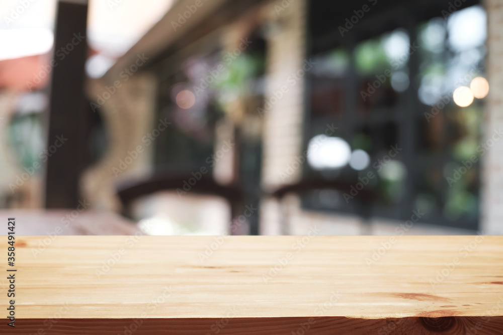 Blurred background of home garden picnic and wooden table free space for product display.