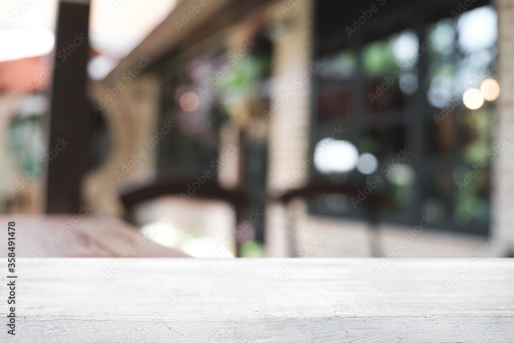 Blurred background of home garden picnic and wooden table free space for product display. Blurred background of home garden picnic and wooden table free space for product display.