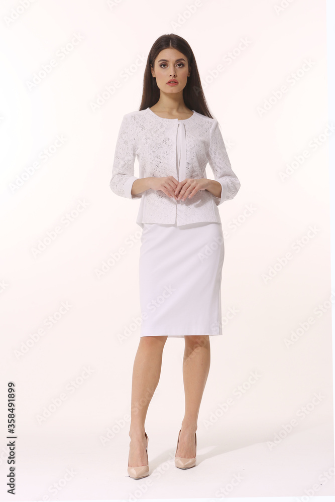 Indian business woman executive posing in official white skirt suit Indian business woman executive posing in official white skirt suit