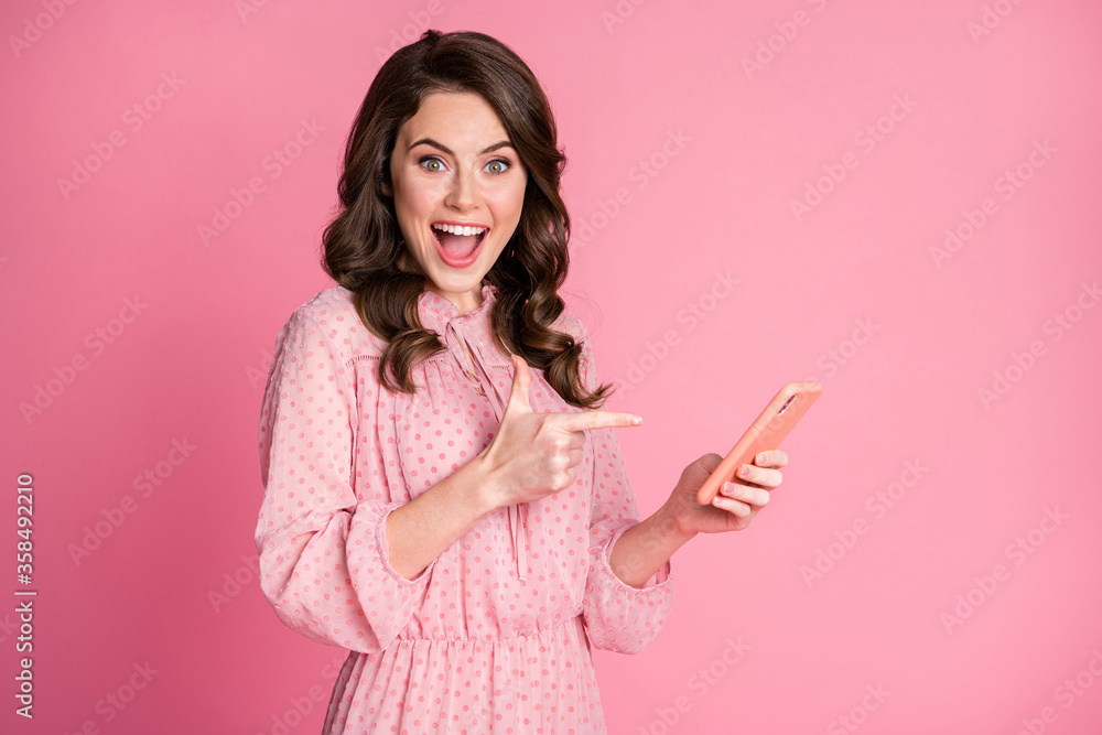 Portrait of her she nice-looking attractive lovely charming elegant glad cheerful cheery wavy-haired girl using cell demonstrating new post smm notification isolated on pink pastel color background Portrait of her she nice-looking attractive lovely charming elegant glad cheerful cheery wavy-haired girl using cell demonstrating new post smm notification isolated on pink pastel color background