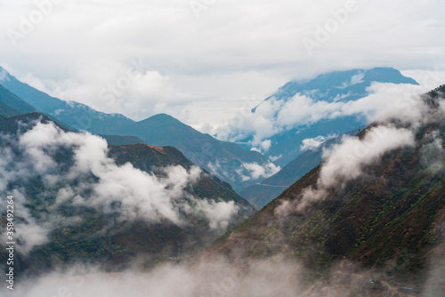 Yangtza river through the mountains with clouds