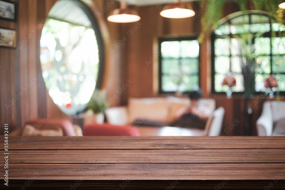Empty wooden table space platform and blurred restaurant or coffee shop background for product display montage. Empty wooden table space platform and blurred restaurant or coffee shop background for product display montage.