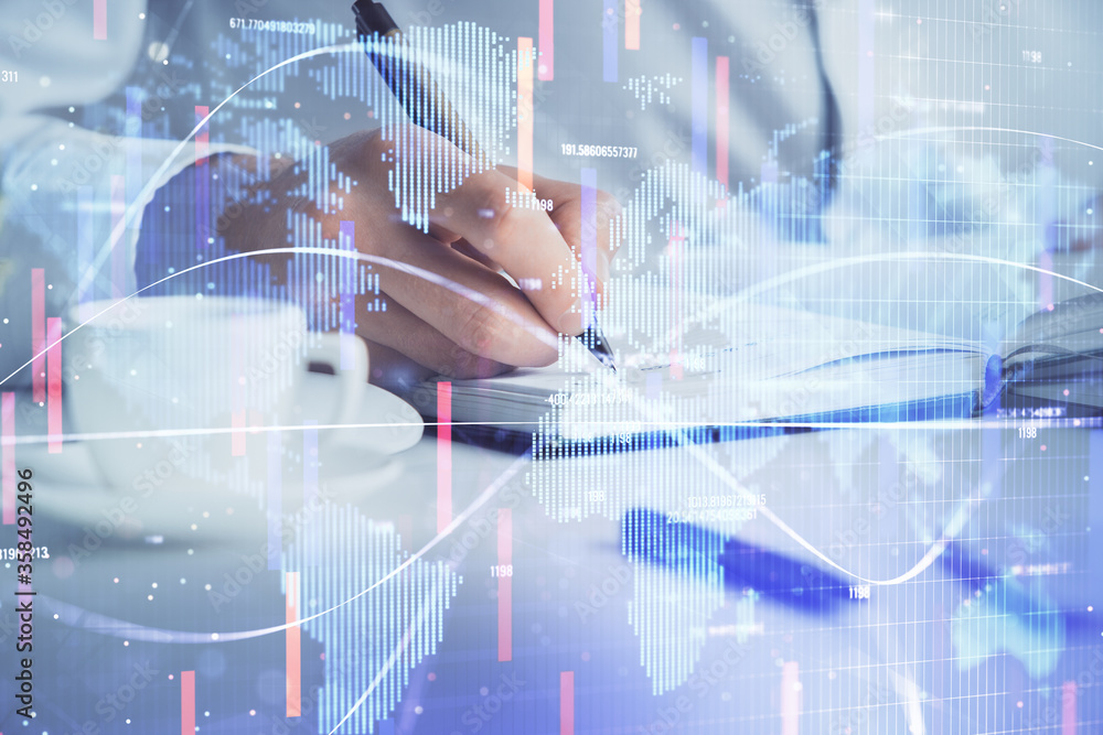 Double exposure of hands and notepad with business icons. Double exposure of hands and notepad with business icons.