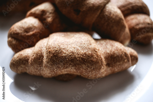 Croissants on a white plate. Fresh bakery