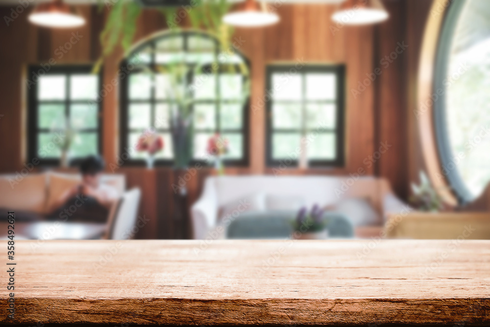 Empty wooden table space platform and blurred restaurant or coffee shop background for product display montage. Empty wooden table space platform and blurred restaurant or coffee shop background for product display montage.