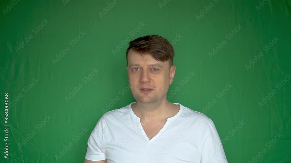 Satisfied fatigued man takes off the mask from his face and overjoyed bright daylight blue eyes Satisfied fatigued man takes off the mask from his face and overjoyed bright daylight blue eyes