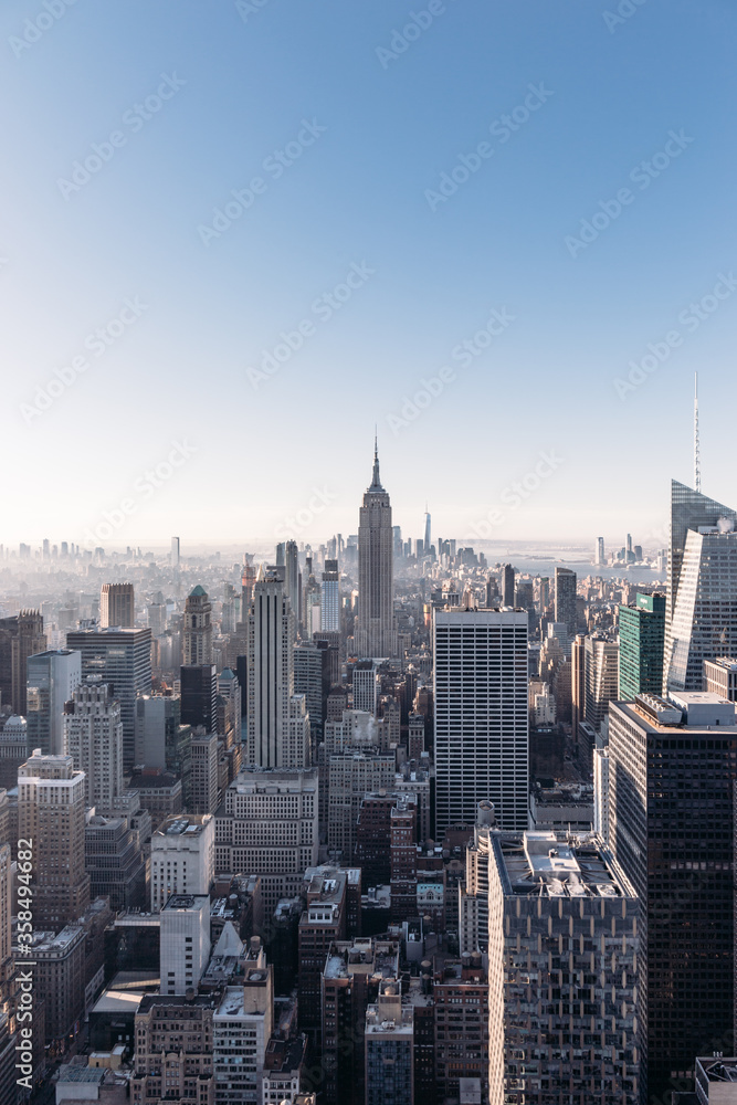 Panoramic view of Midtown and Lower Manhattan with the Empire State Building in New York City from the Top of the Rock observation deck
