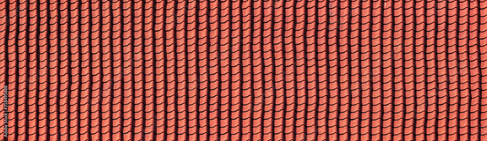 Panorama of a red tiled roof texture. pattern of antique roof tile. Panorama of a red tiled roof texture. pattern of antique roof tile.