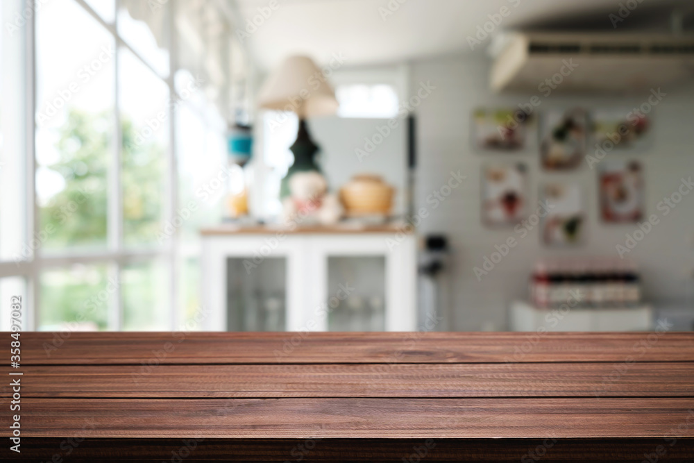 Empty wooden table space platform and blurred restaurant or coffee shop background for product display montage. Empty wooden table space platform and blurred restaurant or coffee shop background for product display montage.