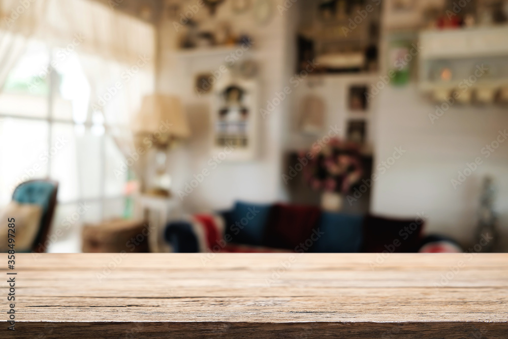 Wooden desk space platform and blurred restaurant or coffee shop background for product display montage. Wooden desk space platform and blurred restaurant or coffee shop background for product display montage.