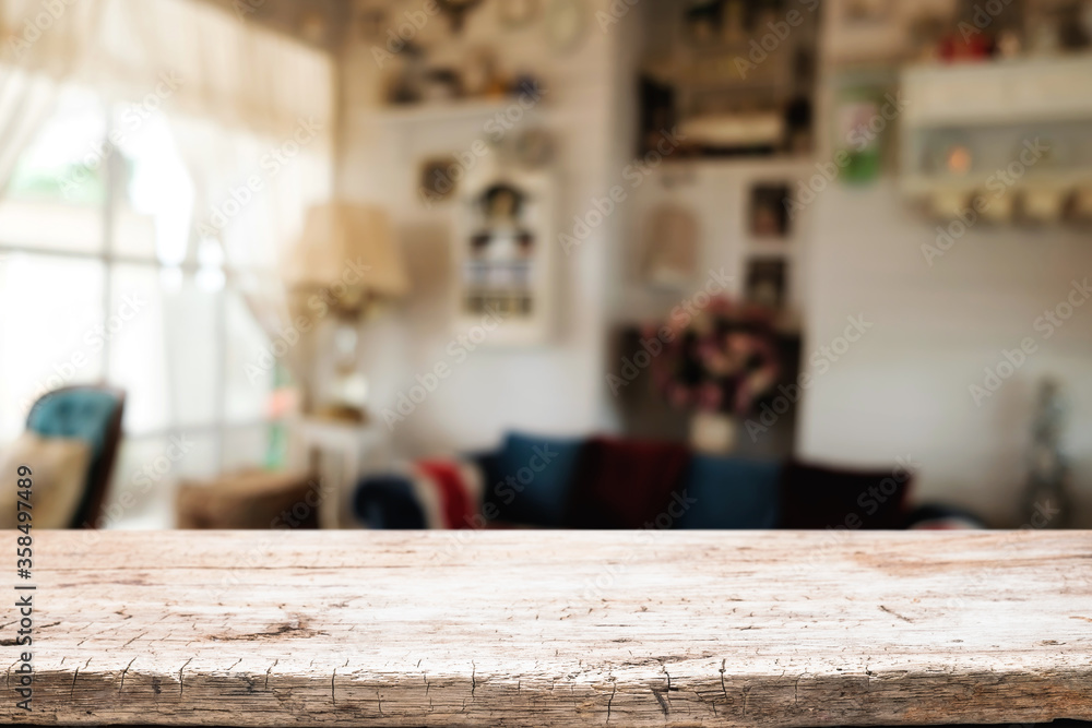 Wooden desk space platform and blurred restaurant or coffee shop background for product display montage. Wooden desk space platform and blurred restaurant or coffee shop background for product display montage.