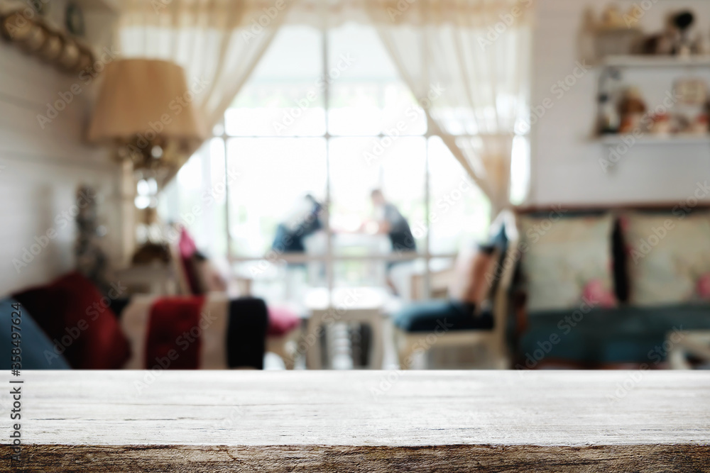 Empty wooden table space platform and blurred restaurant or coffee shop background for product display montage. Empty wooden table space platform and blurred restaurant or coffee shop background for product display montage.