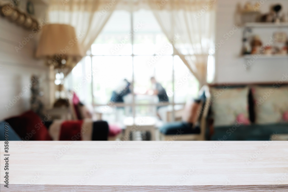 Empty wooden table space platform and blurred restaurant or coffee shop background for product display montage. Empty wooden table space platform and blurred restaurant or coffee shop background for product display montage.