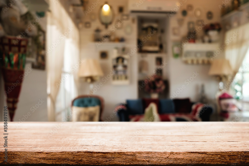 Wooden table space platform and blurred restaurant or coffee shop background for product display montage. Wooden table space platform and blurred restaurant or coffee shop background for product display montage.