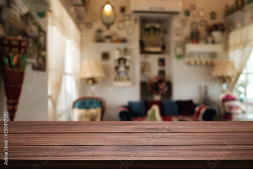 Wooden table space platform and blurred restaurant or coffee shop background for product display montage.