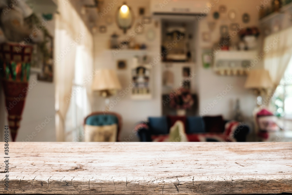 Wooden table space platform and blurred restaurant or coffee shop background for product display montage. Wooden table space platform and blurred restaurant or coffee shop background for product display montage.