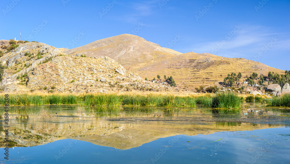 It's Panorama of the mountains ana the lake Titicaca in Peru