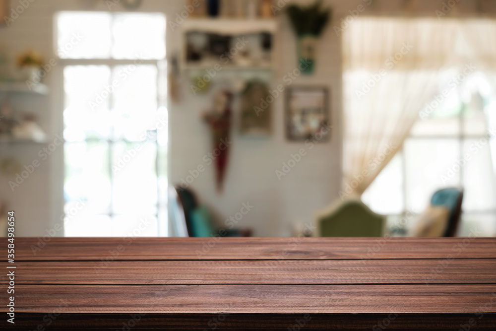 Empty wooden table space platform and blurred restaurant or coffee shop background for product display montage. Empty wooden table space platform and blurred restaurant or coffee shop background for product display montage.