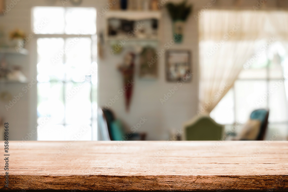 Empty wooden table space platform and blurred restaurant or coffee shop background for product display montage. Empty wooden table space platform and blurred restaurant or coffee shop background for product display montage.