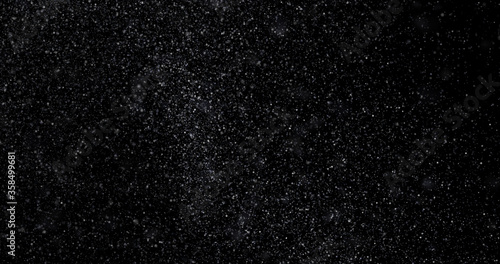 abstract Flying dust particles on a black background