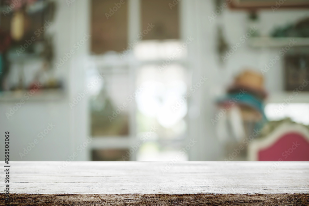 Empty wooden table space platform and blurred restaurant or coffee shop background for product display montage. Empty wooden table space platform and blurred restaurant or coffee shop background for product display montage.