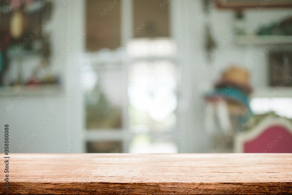 Empty wooden table space platform and blurred restaurant or coffee shop background for product display montage. Empty wooden table space platform and blurred restaurant or coffee shop background for product display montage.