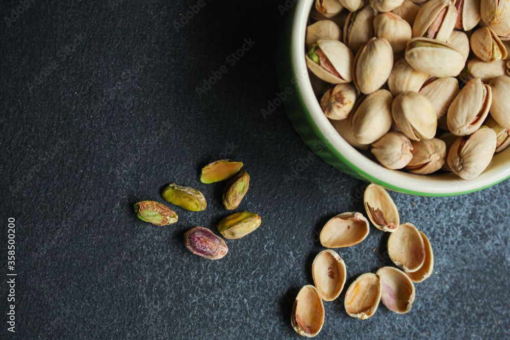 pistachios nuts snack Menu concept serving size. food background top view copy space for text pistachios nuts snack Menu concept serving size. food background top view copy space for text