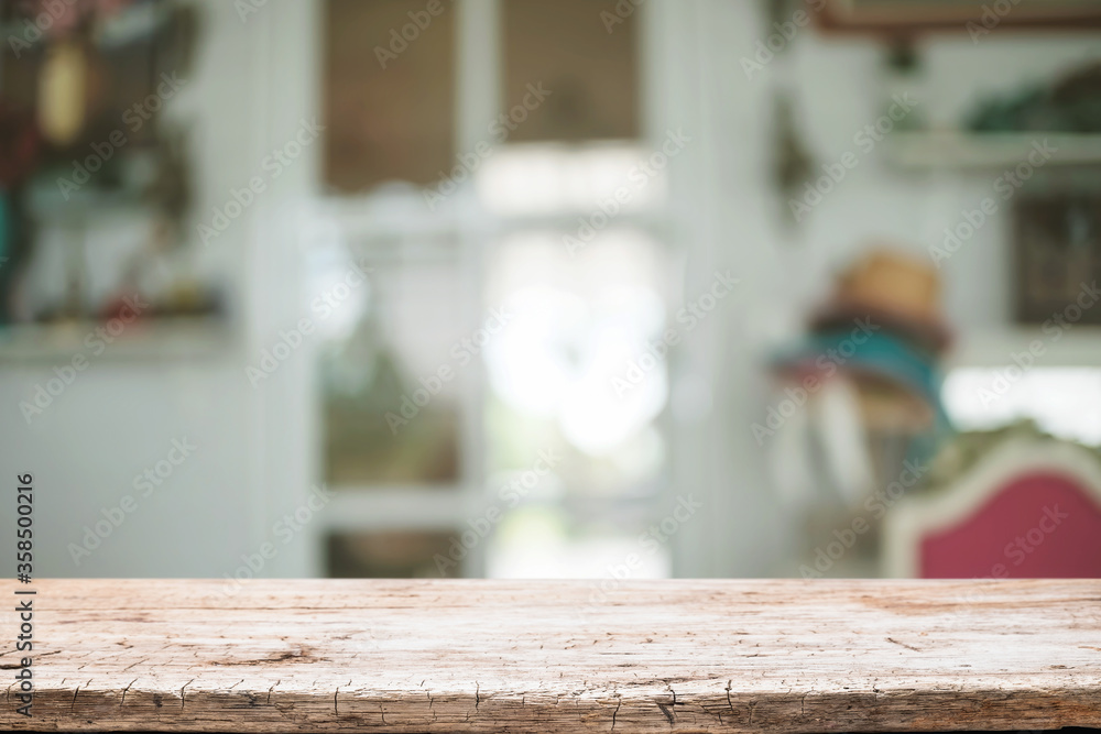 Empty wooden table space platform and blurred restaurant or coffee shop background for product display montage. Empty wooden table space platform and blurred restaurant or coffee shop background for product display montage.