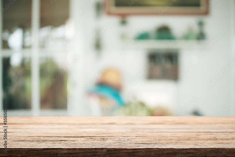 Empty wooden table space platform and blurred resturant or coffee shop background for product display montage. Empty wooden table space platform and blurred resturant or coffee shop background for product display montage.
