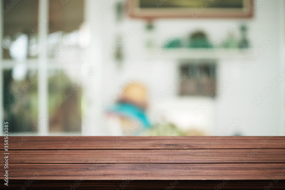 Empty wooden table space platform and blurred resturant or coffee shop background for product display montage. Empty wooden table space platform and blurred resturant or coffee shop background for product display montage.