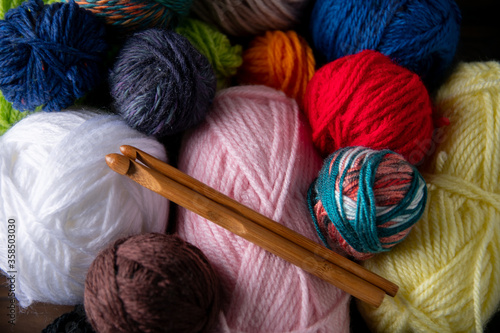 Yarn balls and crochet needles. photo