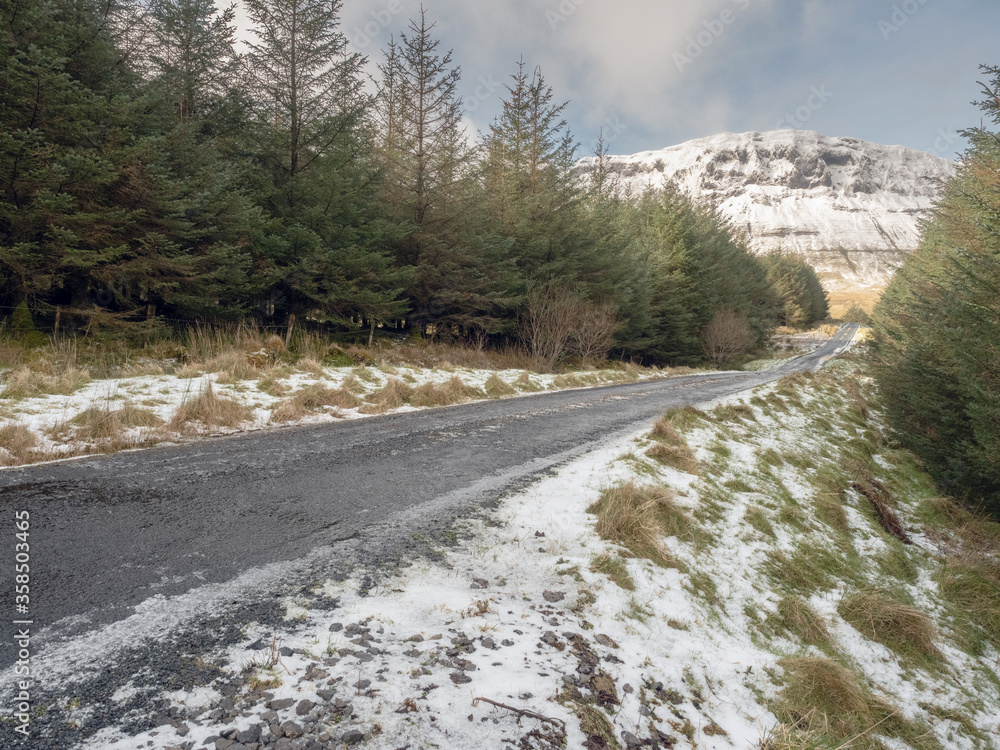 Road in a mountains, The Gleniff Horseshoe loop drive in county Sligo Ireland, Mountains covered with snow, Winter season.