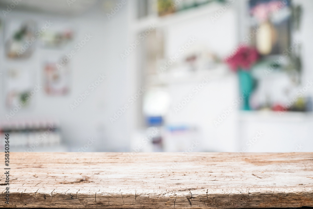 Empty wooden desk space platform over blurred restaurant or coffee shop background for product display montage. Empty wooden desk space platform over blurred restaurant or coffee shop background for product display montage.
