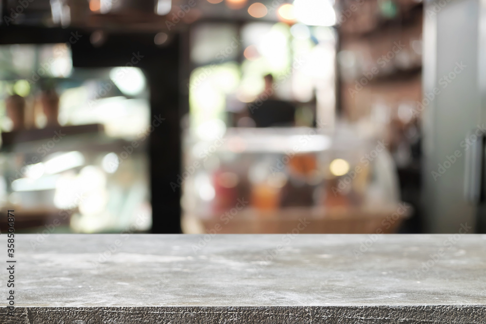 Empty wooden desk space platform over blurred restaurant or coffee shop background for product display montage. Empty wooden desk space platform over blurred restaurant or coffee shop background for product display montage.