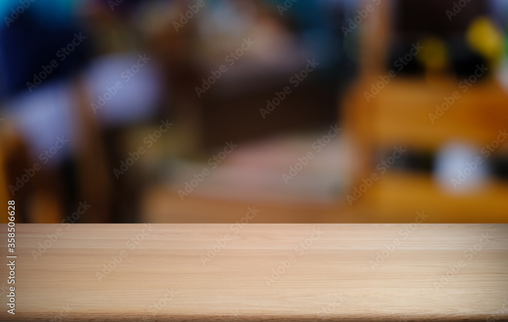 Empty dark wooden table in front of abstract blurred bokeh background of restaurant . can be used for display or montage your products.Mock up for space. Empty dark wooden table in front of abstract blurred bokeh background of restaurant . can be used for display or montage your products.Mock up for space.