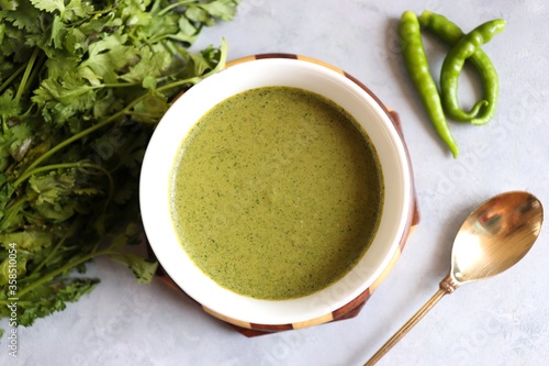 Spicy and tasty Coriander Mint Green Chutney. Hara Dhaniya Chutney, Coriander Dip. Healthy dips. along with spices and copy space.