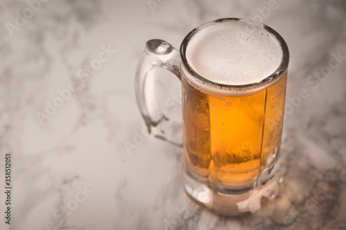 Cold beer concept on marble floor